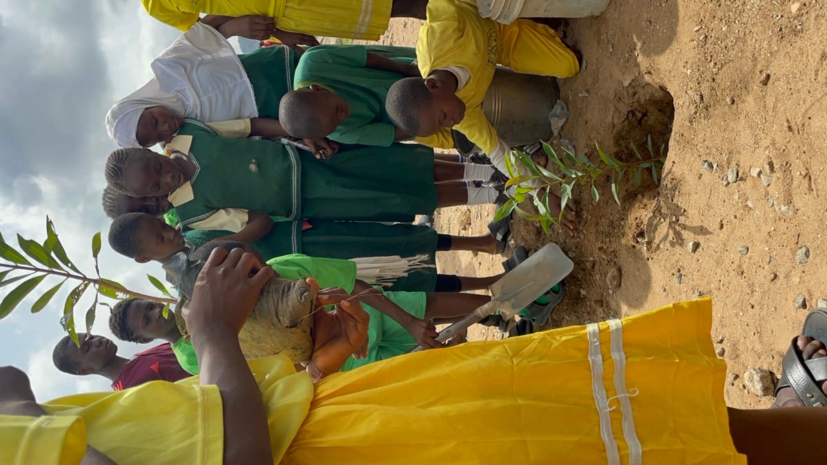 Children planting trees with the EcoCulture team